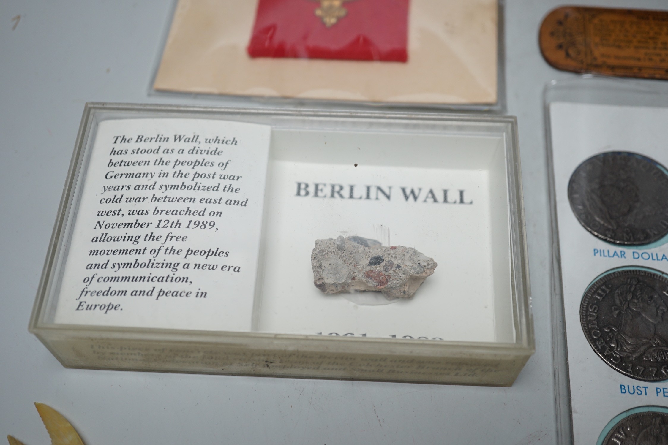 A collection of collectibles: a mother of pearl carves fish, a Mauchlin postal ruler, an enamel box and trays, coinage and various military badges etc